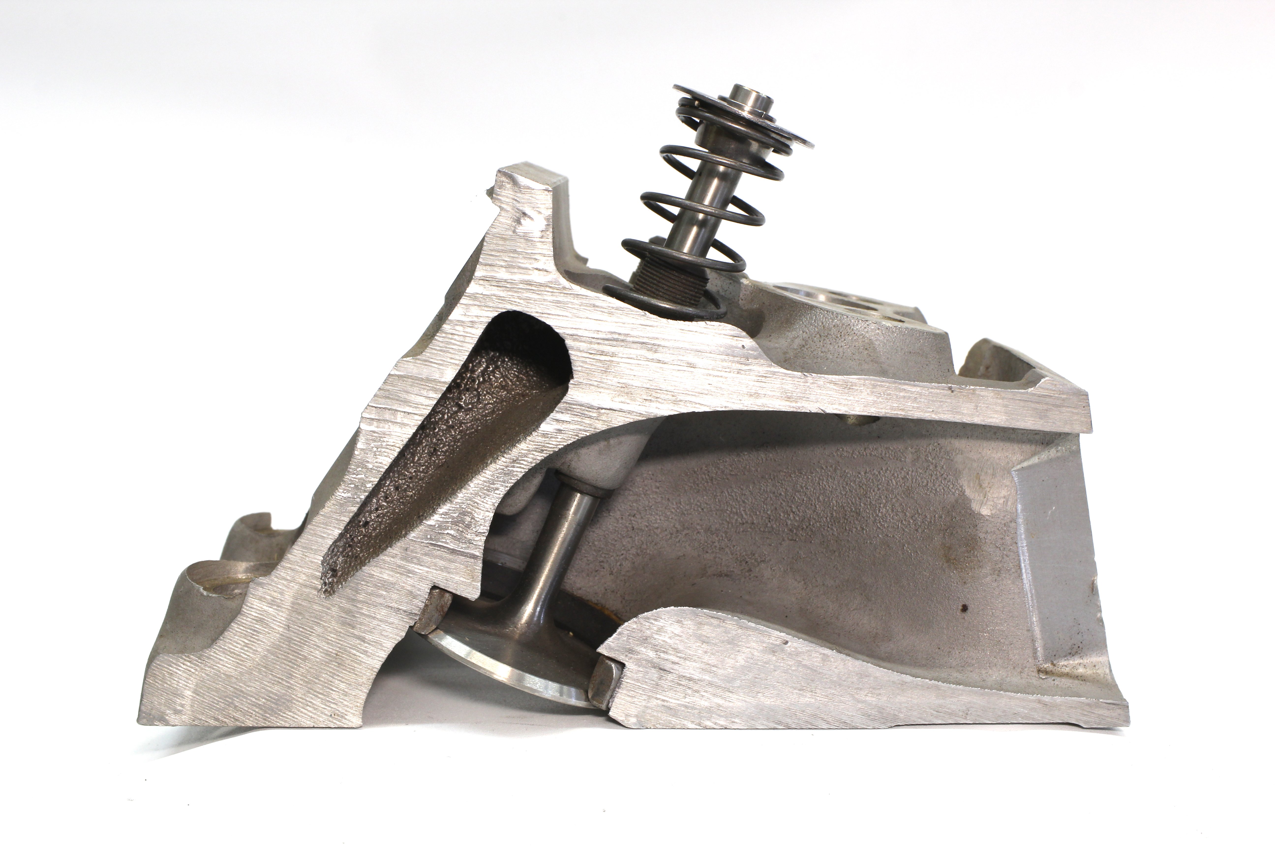 This small-block Chevy head cutaway illustrates the valve angle as measured from true vertical. The stock small-block angle is 23 degrees but as the angle approaches true vertical, the port flow improves. This is why the original production LS heads use a 15-degree valve angle. 